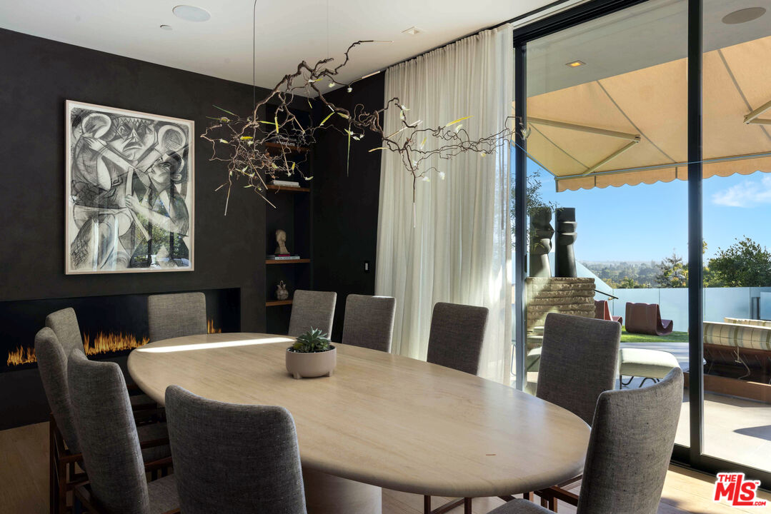 815 North Tigertail Road Los Angeles, CA 90049 - Photo 5 of 26 a view of a dining room with furniture window and outside view