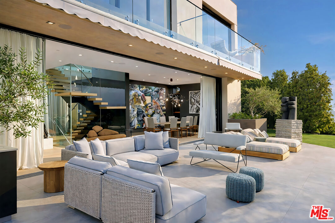 815 North Tigertail Road Los Angeles, CA 90049 - Photo 6 of 26 a outdoor living space with patio furniture and a potted plant