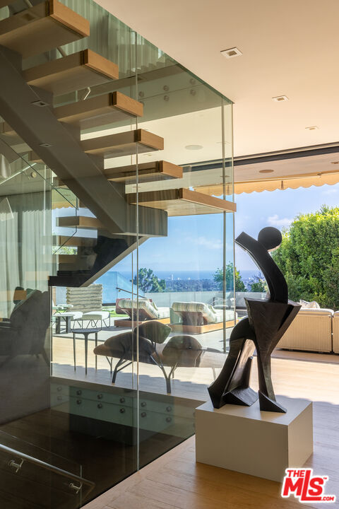 815 North Tigertail Road Los Angeles, CA 90049 - Photo 7 of 26 a view of swimming pool with a balcony and furniture