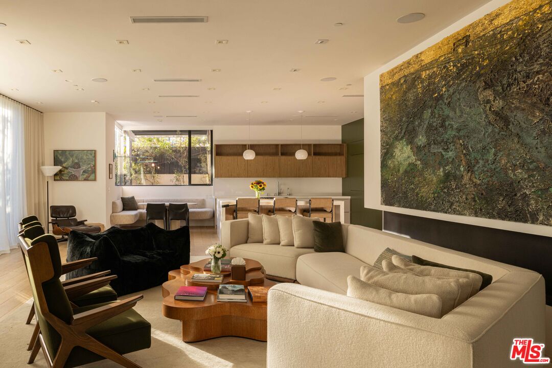 815 North Tigertail Road Los Angeles, CA 90049 - Photo 8 of 26 a living room with furniture and a large window