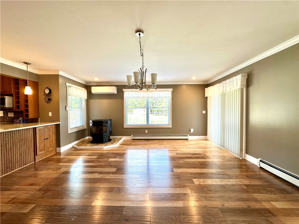 3046 Wood Road Orange, NY 14815 - Photo 12 of 47 dining room with pellet stove