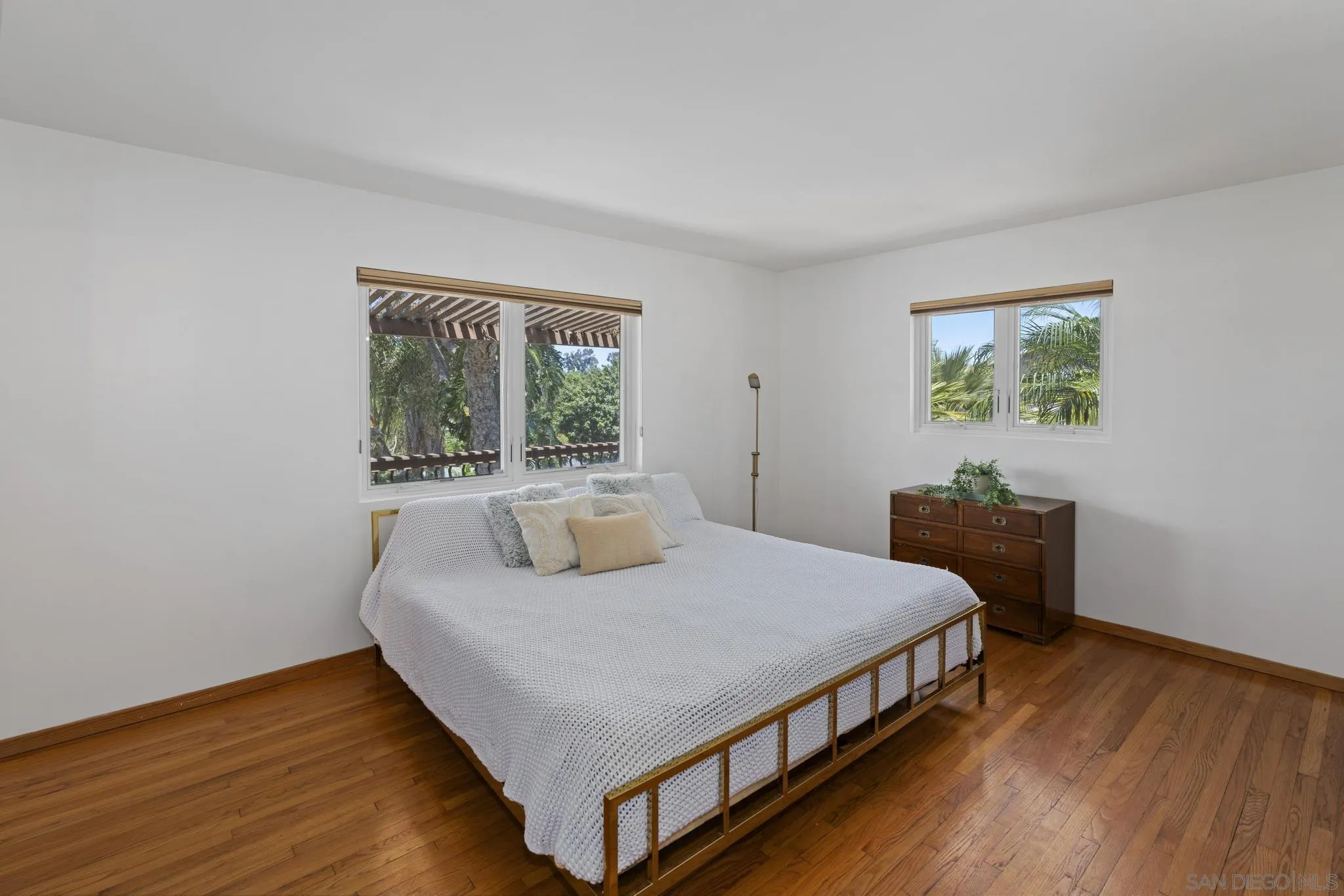 923 Sunset Drive Vista, CA 92081 - Photo 15 of 74 a bedroom with a bed and a table