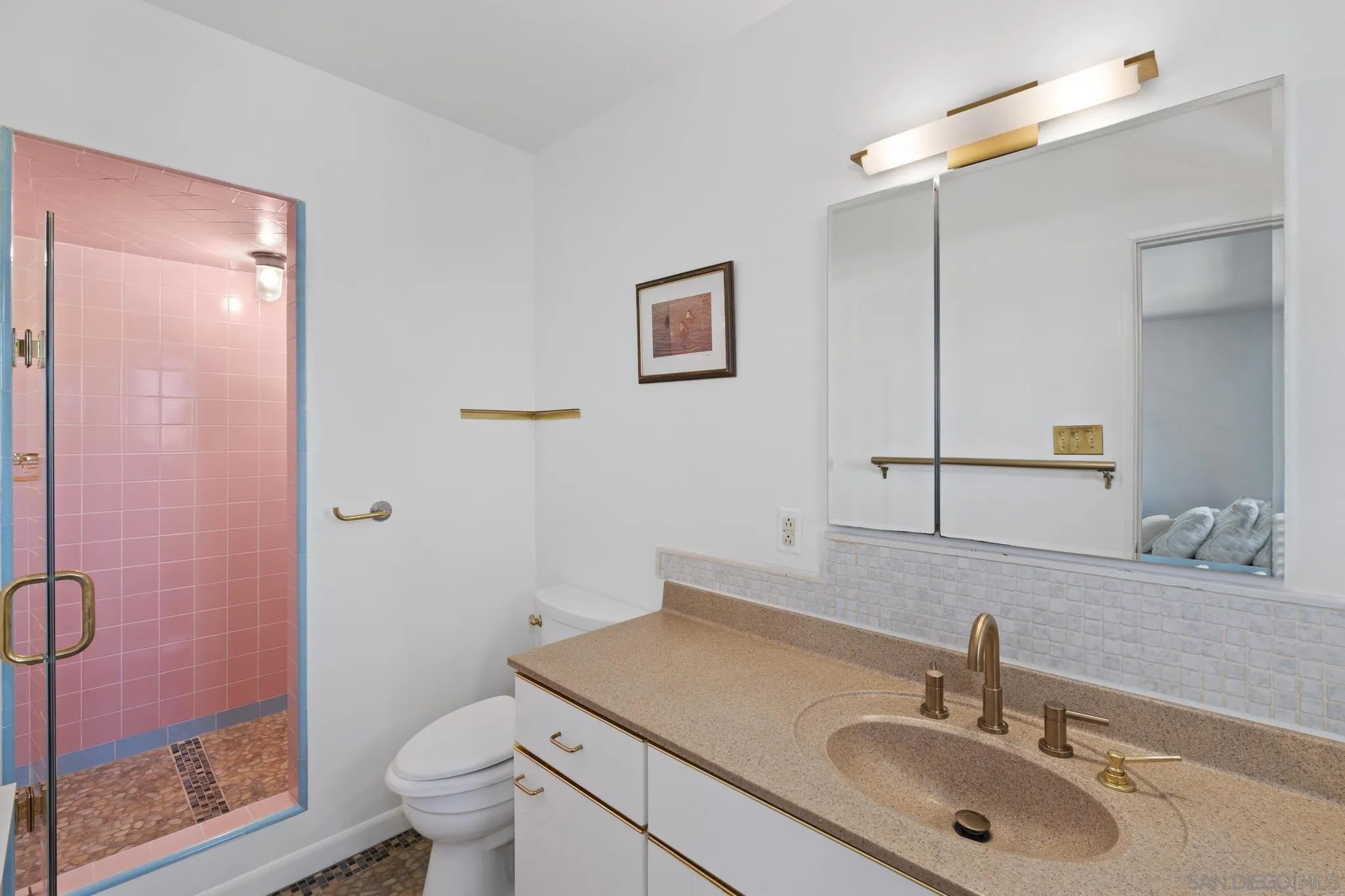 923 Sunset Drive Vista, CA 92081 - Photo 19 of 74 a bathroom with a sink toilet and shower