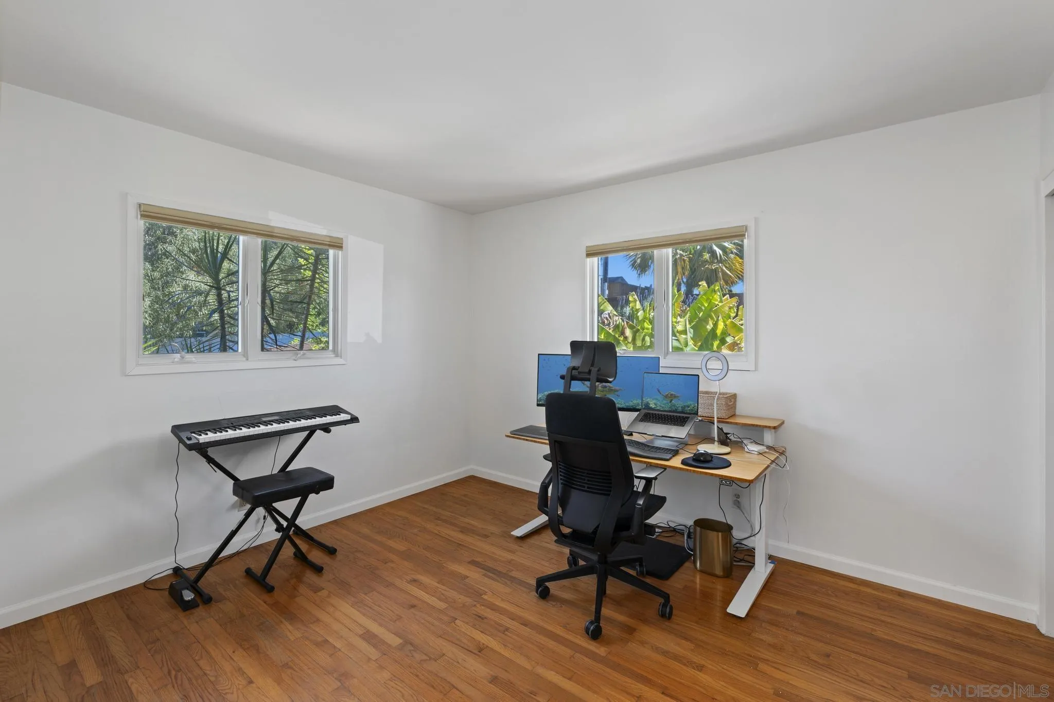 923 Sunset Drive Vista, CA 92081 - Photo 20 of 74 a view of a workspace with furniture and a window