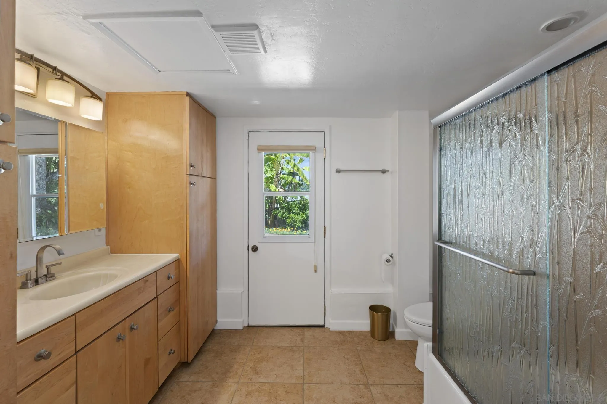 923 Sunset Drive Vista, CA 92081 - Photo 27 of 74 a bathroom with a double vanity sink and a
