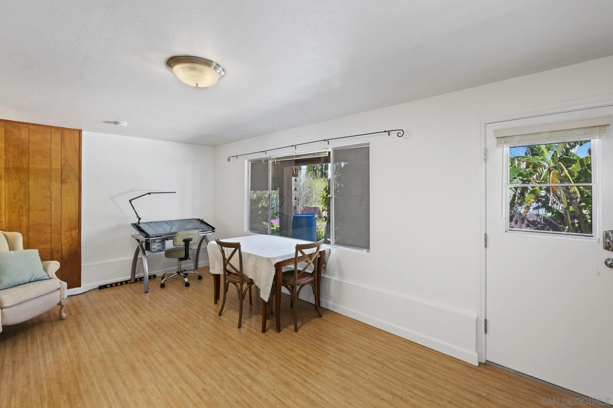 923 Sunset Drive Vista, CA 92081 - Photo 32 of 74 a view of a dining room with furniture and wooden floor