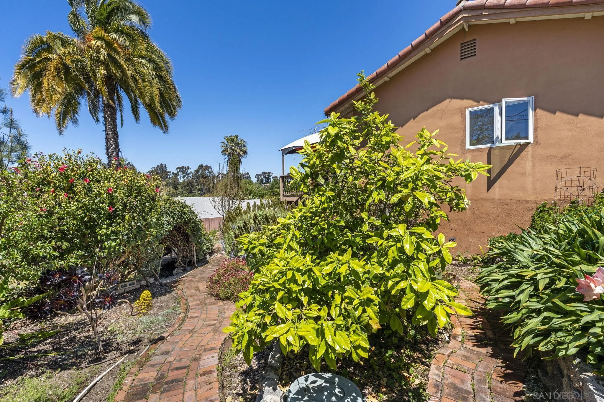 923 Sunset Drive Vista, CA 92081 - Photo 48 of 74 a front view of a house with a yard