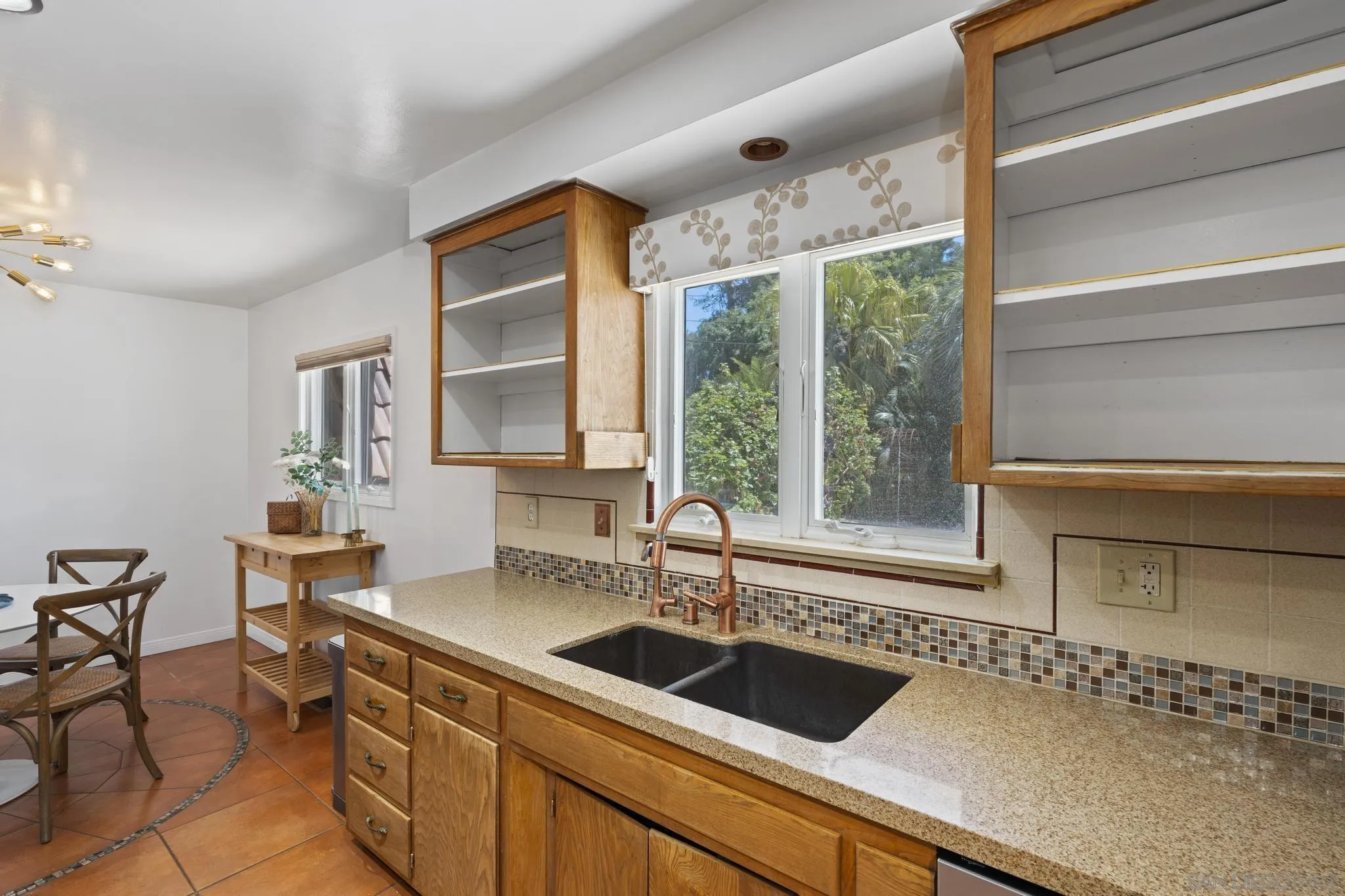 923 Sunset Drive Vista, CA 92081 - Photo 5 of 74 a kitchen with a sink and a refrigerator