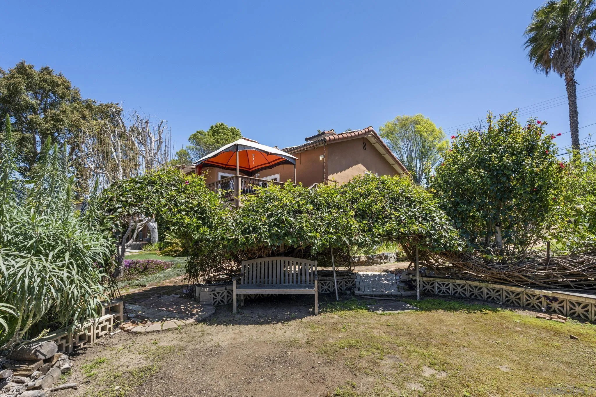 923 Sunset Drive Vista, CA 92081 - Photo 51 of 74 a backyard of a house with table and chairs
