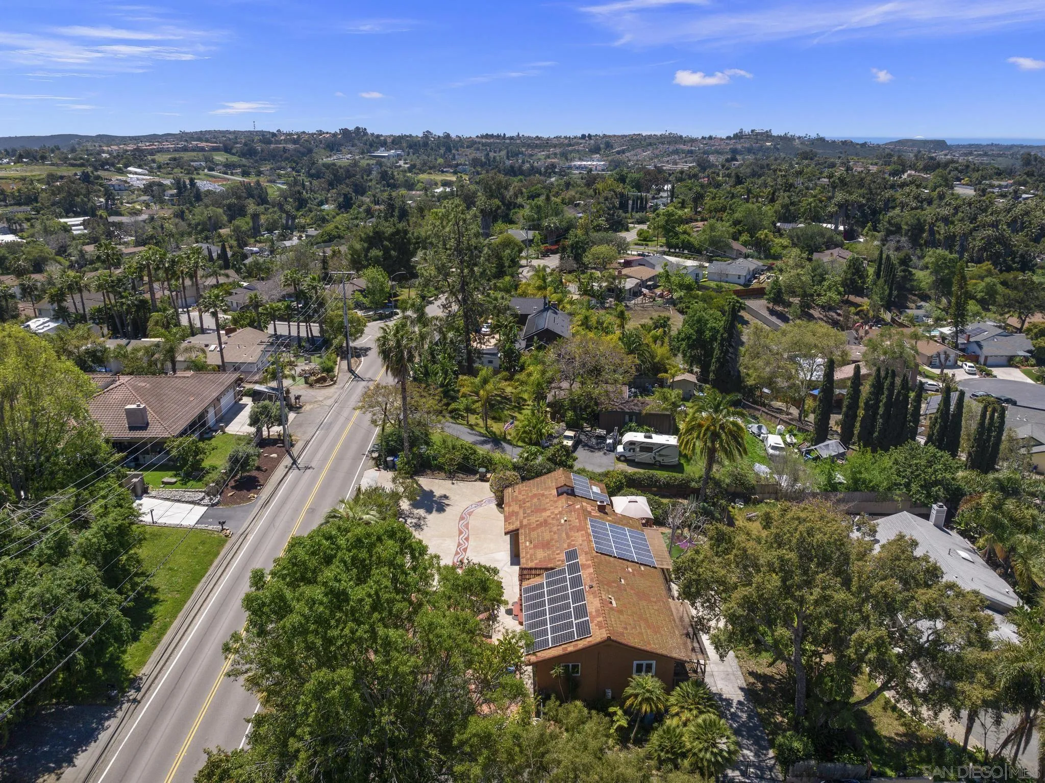 923 Sunset Drive Vista, CA 92081 - Photo 66 of 74 an aerial view of residential houses with outdoor space and trees