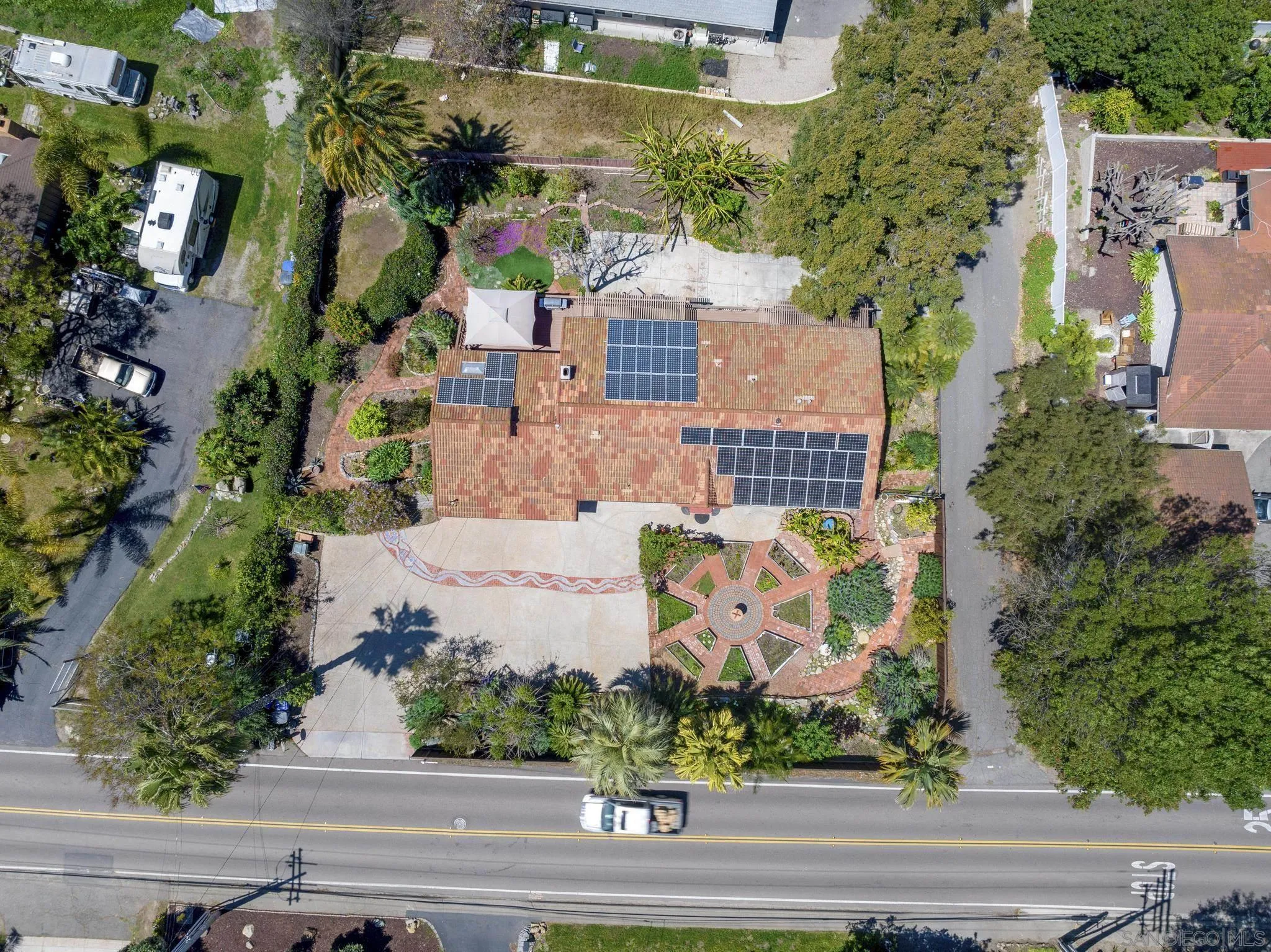923 Sunset Drive Vista, CA 92081 - Photo 72 of 74 an aerial view of a house with a garden and statue