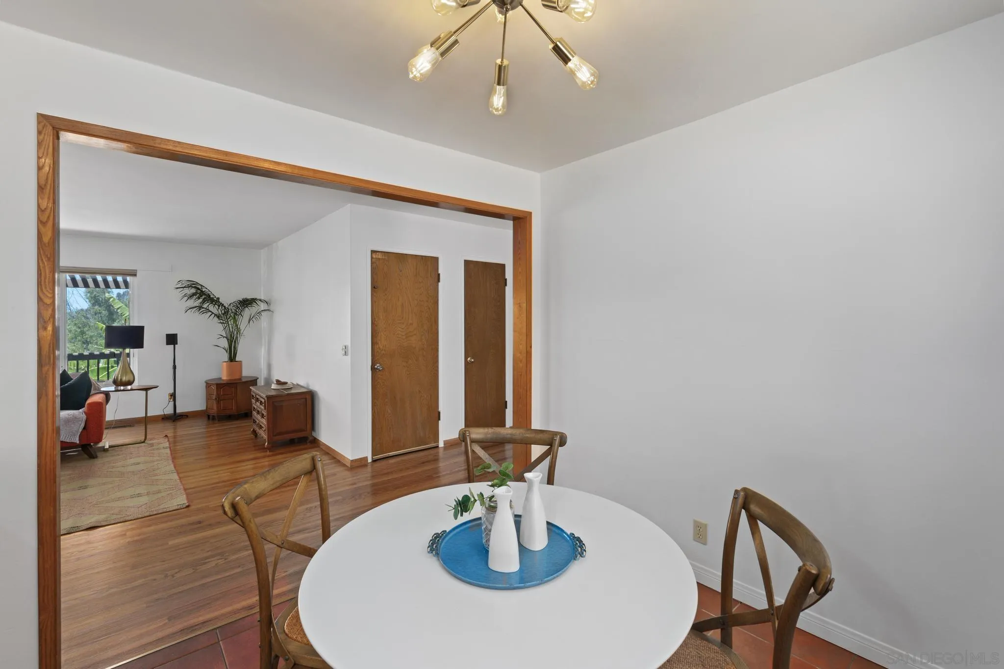 923 Sunset Drive Vista, CA 92081 - Photo 8 of 74 a view of a dining room with furniture and wooden floor