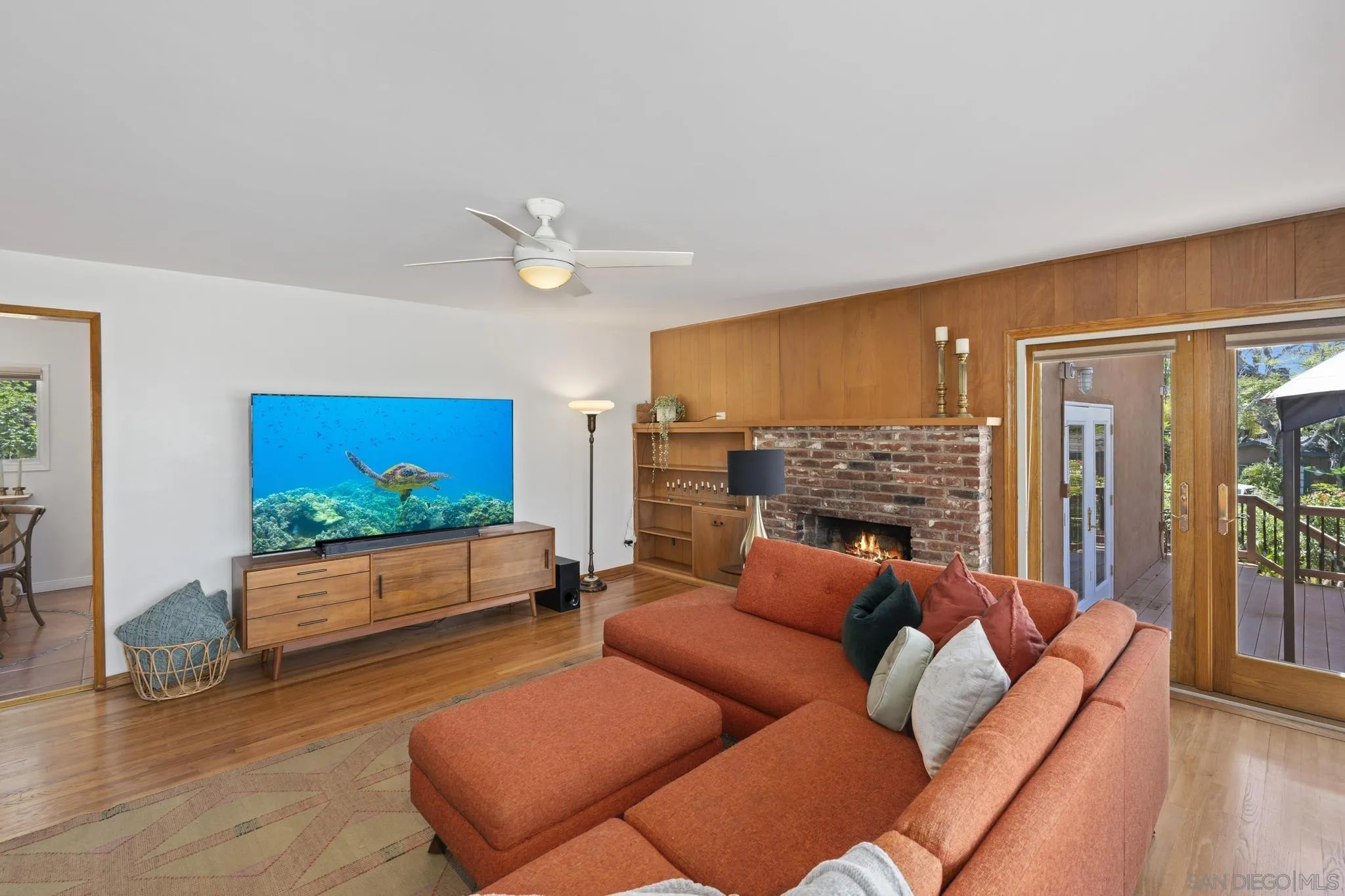 923 Sunset Drive Vista, CA 92081 - Photo 10 of 74 a living room with furniture fireplace and a flat screen tv