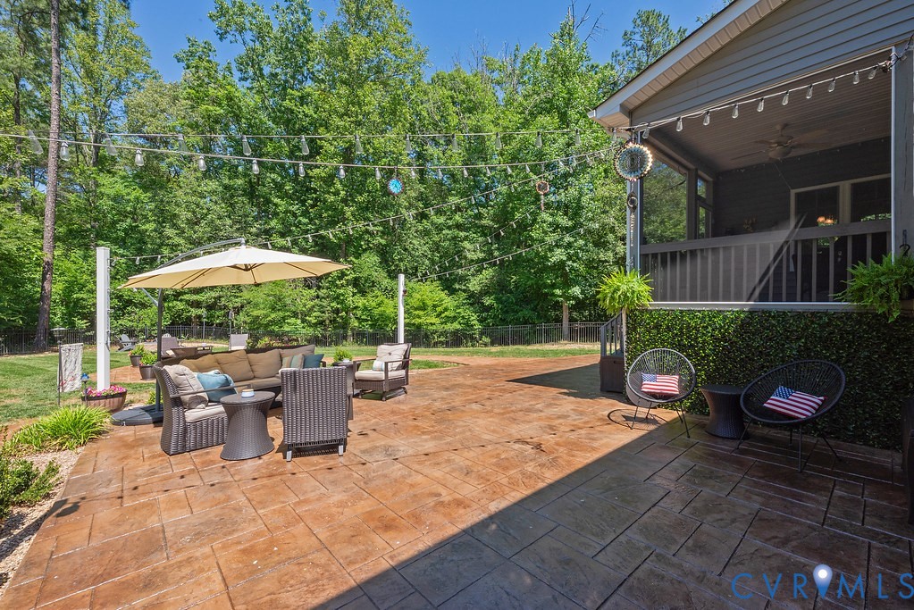 6446 Chestnut Church Road Mechanicsville, VA 23116 - Photo 36 of 49 Stamped concrete patio featuring an outdoor dining