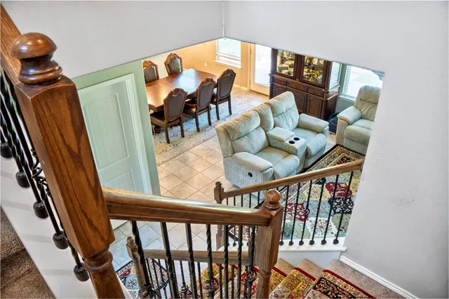 a living room with furniture and kitchen view