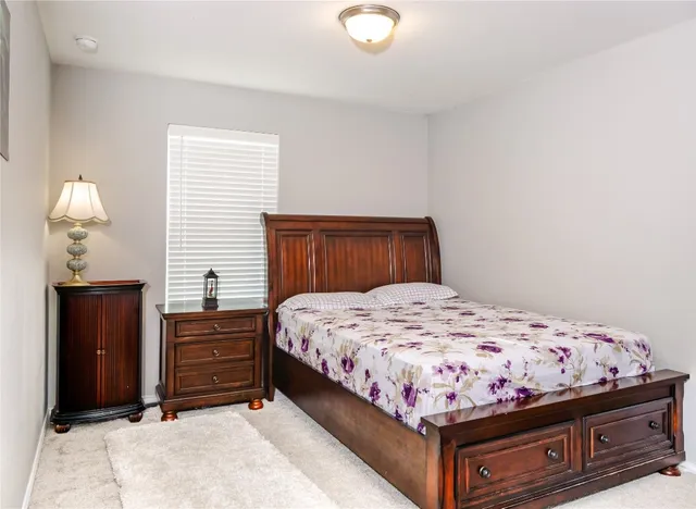 a bathroom with a granite countertop sink and mirror