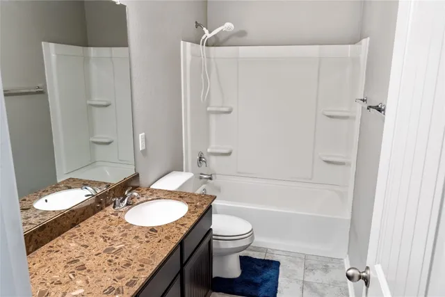 a view of a bathroom with shower curtain