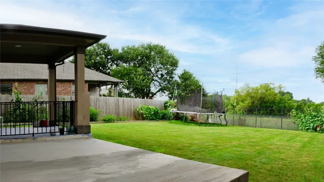 a front view of house with yard and outdoor seating
