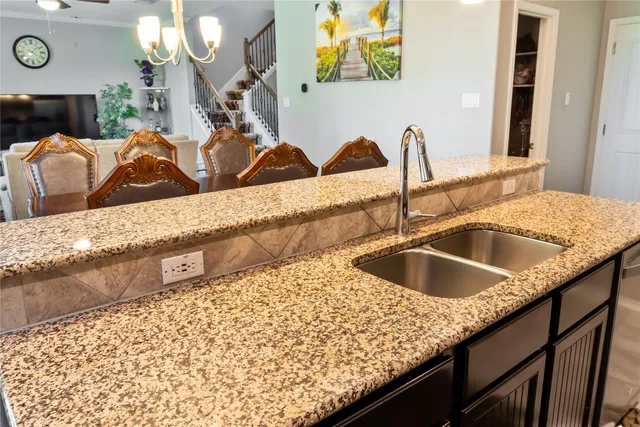 a view of a house with a yard and sitting area