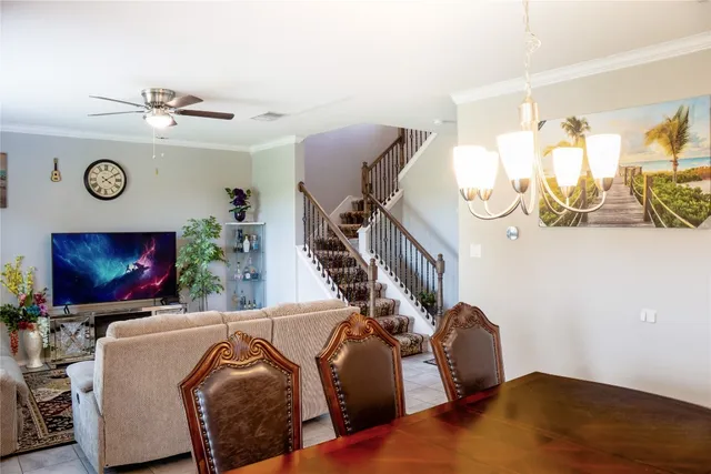a kitchen with a sink and a wooden floor
