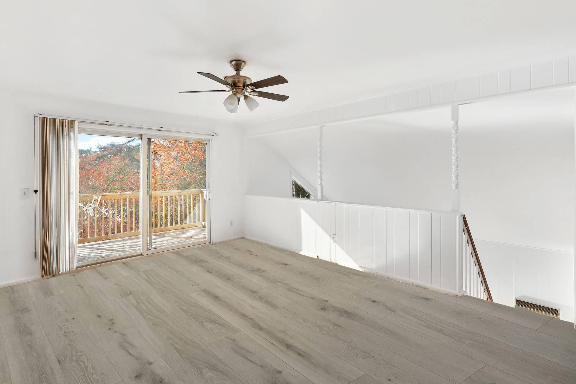 16 Peconic Road Hampton Bays, NY 11946 - Photo 5 of 17 a view of an empty room with a window