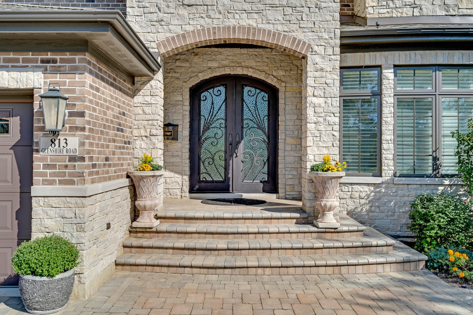 813 Glenshire Road Glenview, IL 60025 - Photo 3 of 59 a front view of a house with potted plants