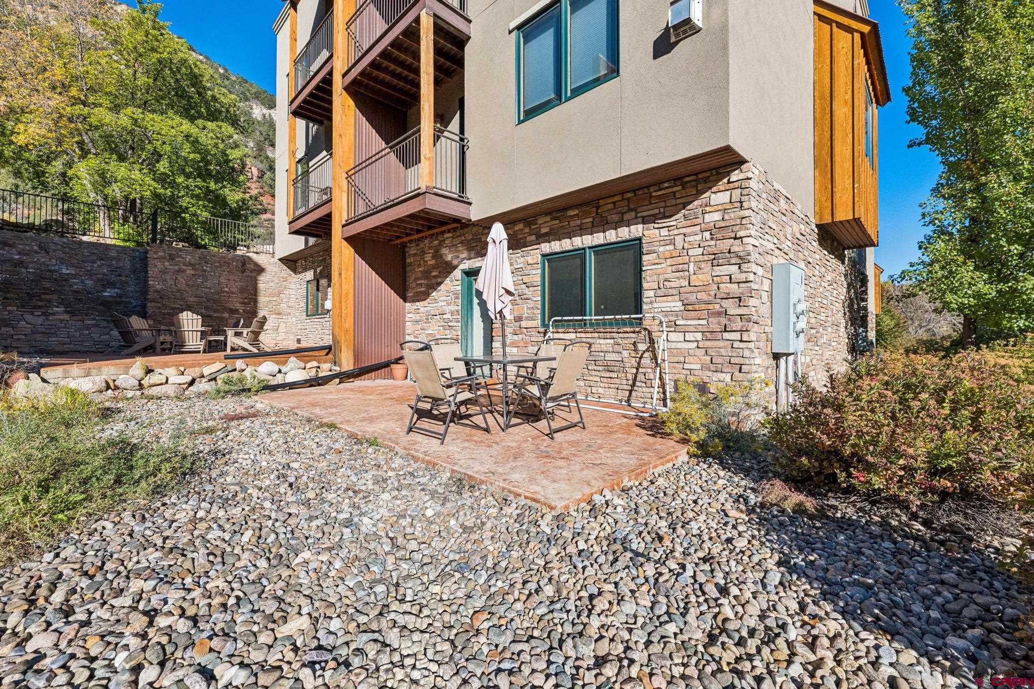 1422 Animas View Drive, Unit 55 Durango, CO 81301 - Photo 2 of 44 a view of a house with backyard and sitting area