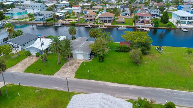 an aerial view of a house with a lake view