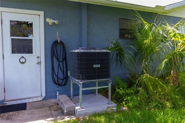 a couple of potted plants in front of door