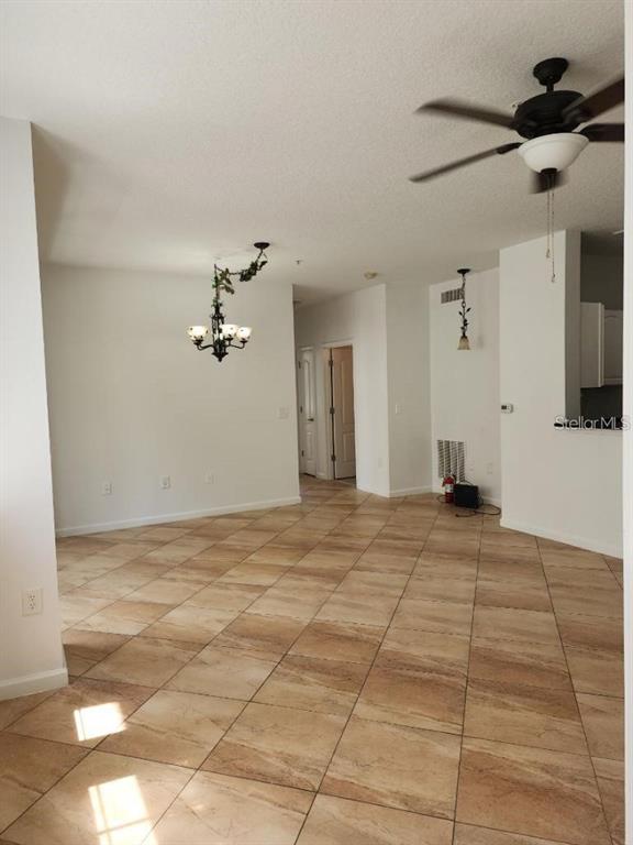 5255 Cane Island Loop, Unit 304 Kissimmee, FL 34746 - Photo 11 of 14 a view of a livingroom with a kitchen