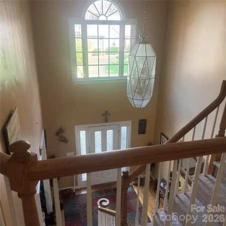 a view of an entryway with wooden floor