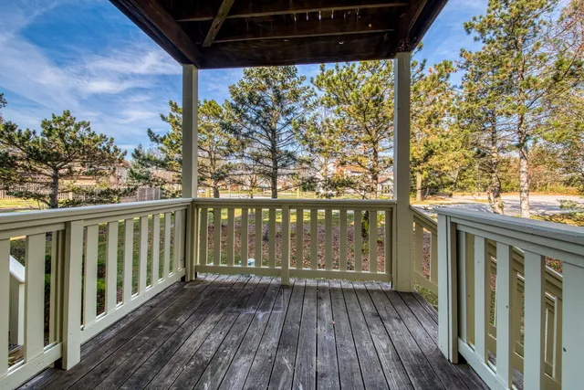 a view of balcony with wooden floor