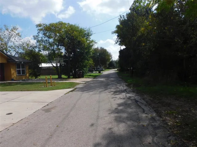 a view of a park with large trees