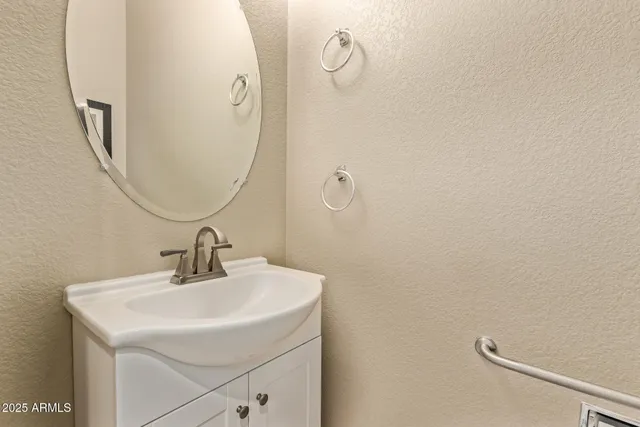 a bathroom with a sink and mirror