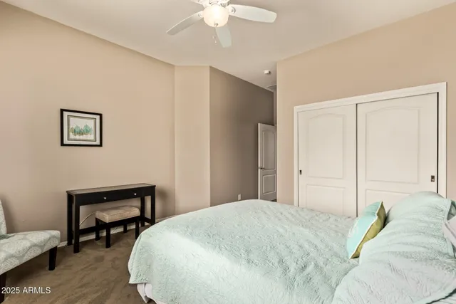 a bedroom with a bed and a table