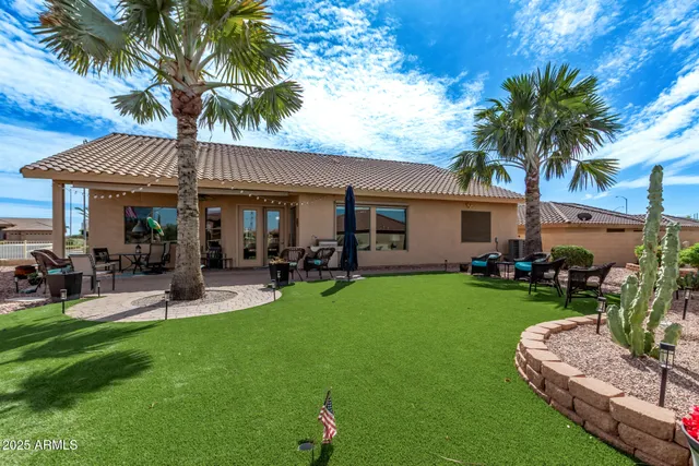 a view of a house with a yard porch and sitting area