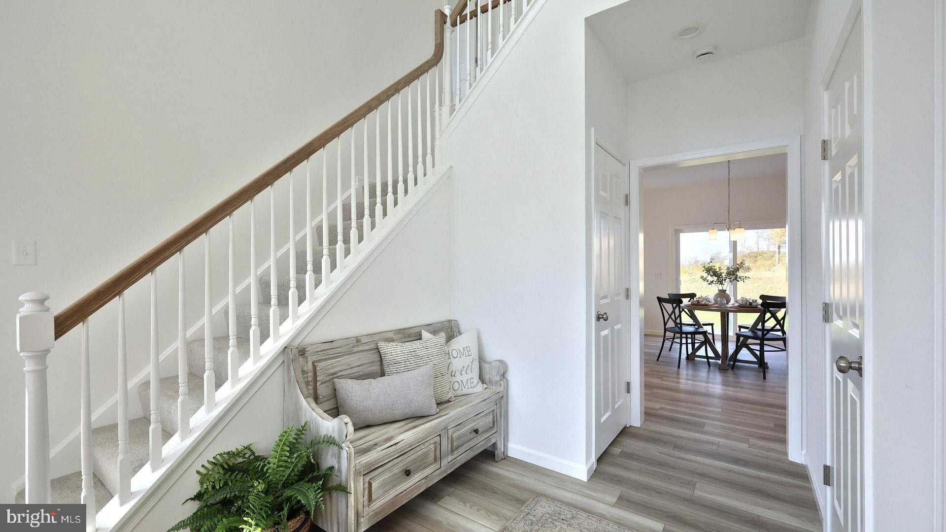 157 Copper Ridge Drive Newmanstown, PA 17073 - Photo 19 of 33 a view of a hallway with wooden floor and stairs