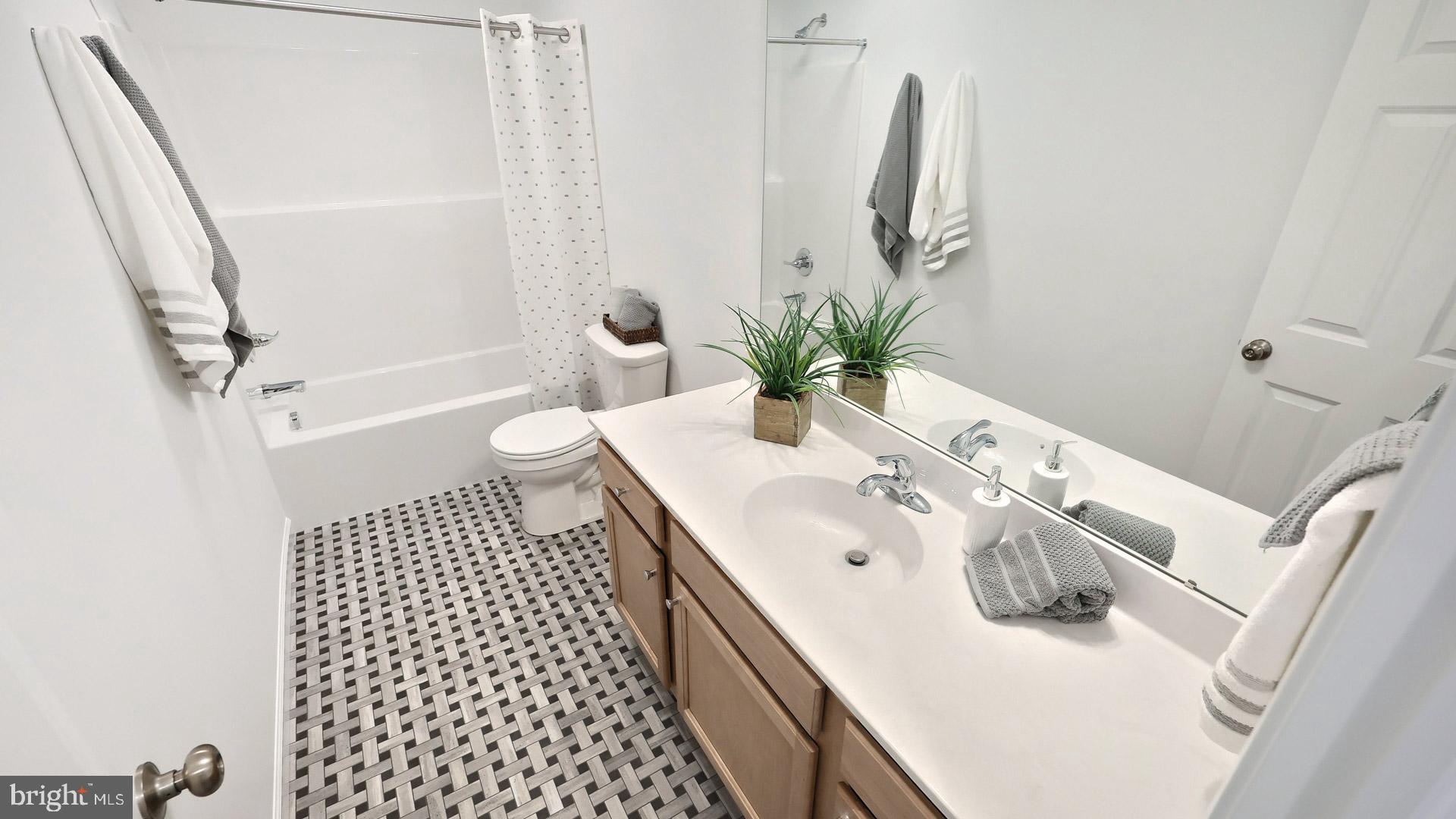 157 Copper Ridge Drive Newmanstown, PA 17073 - Photo 31 of 33 a bathroom with a sink a toilet and shower