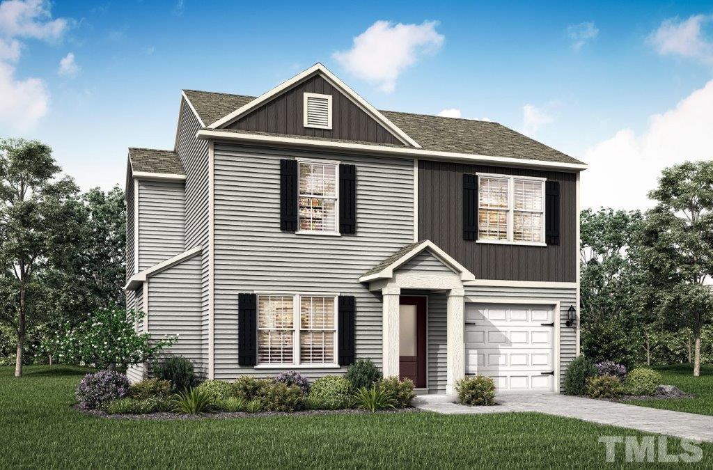 117 Brisk Drive Zebulon, NC 27597 - Photo 1 of 9 a front view of a house with a yard