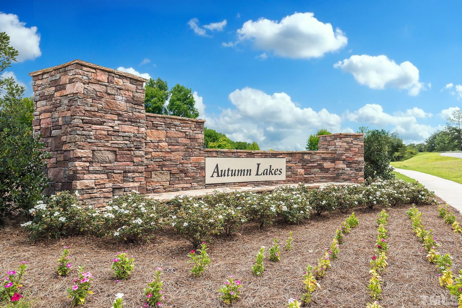 117 Brisk Drive Zebulon, NC 27597 - Photo 4 of 9 a view of a lake with a building in the background