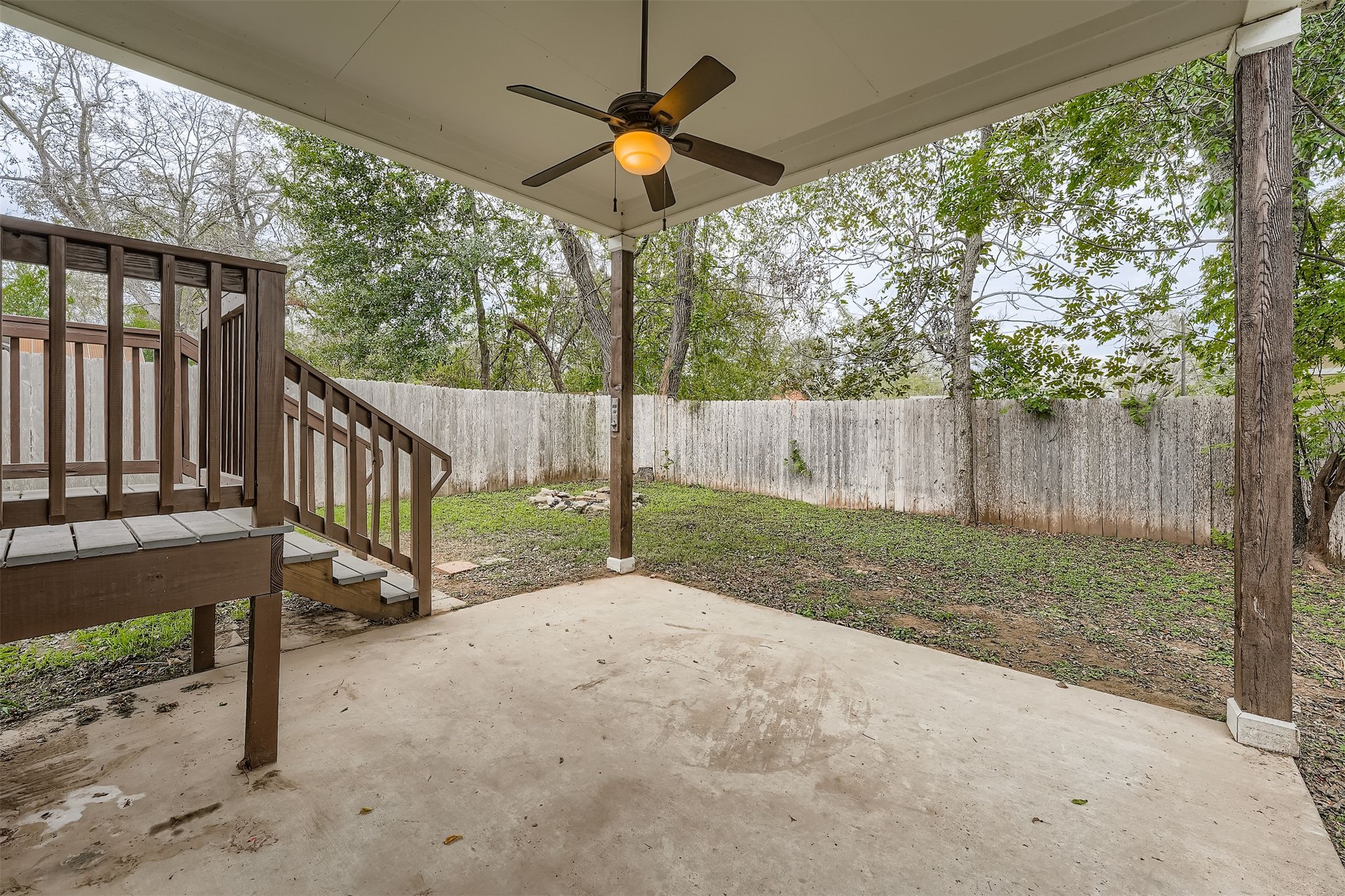 304 South Main Street Elgin, TX 78621 - Photo 24 of 25 Fenced backyard with a patio and ceiling fan