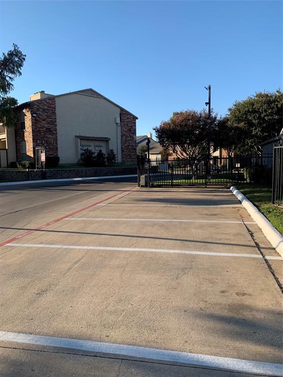 12482 Abrams Road, Unit 1303 Dallas, TX 75243 - Photo 2 of 30 Concrete parking area with painted lines