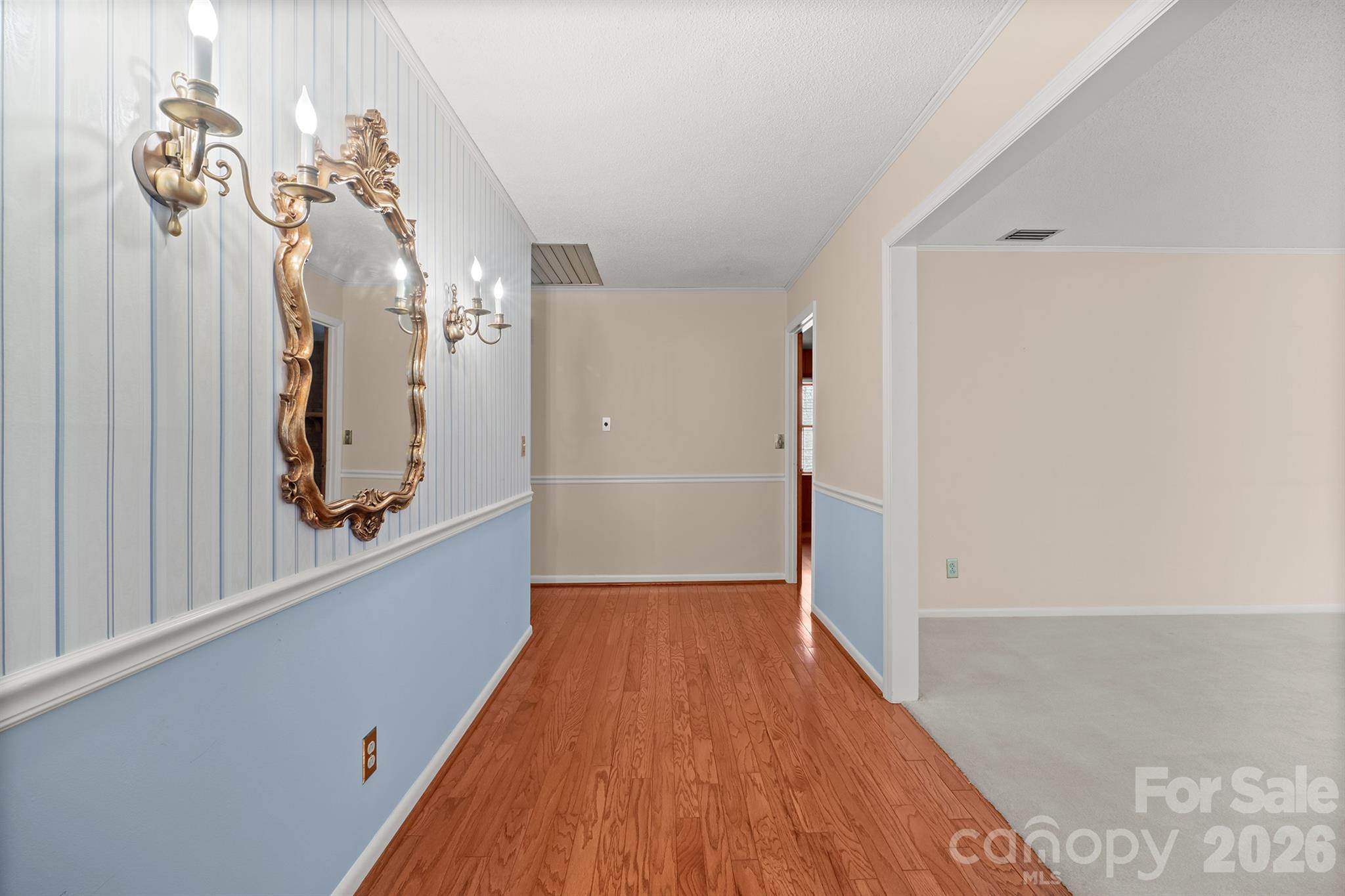 333 Sandy Ford Road Mount Holly, NC 28120 - Photo 11 of 42 a view of a hallway with wooden floor and staircase