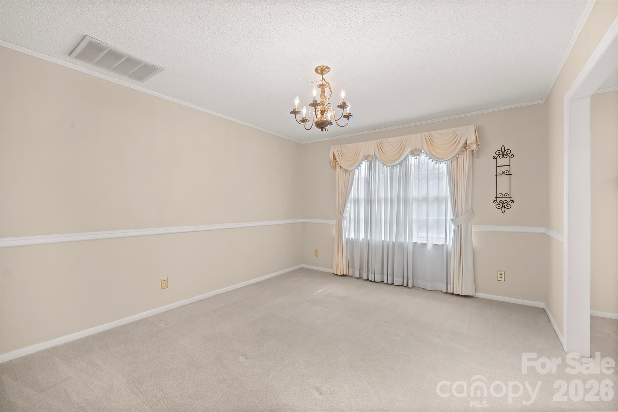 333 Sandy Ford Road Mount Holly, NC 28120 - Photo 15 of 42 an empty room with windows