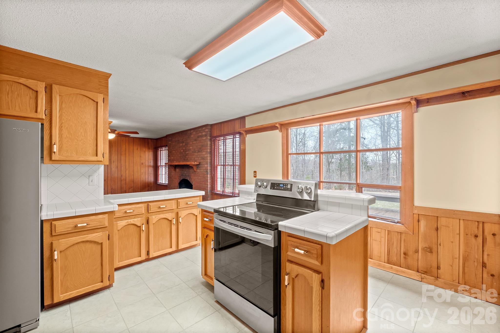 333 Sandy Ford Road Mount Holly, NC 28120 - Photo 19 of 42 a kitchen with stainless steel appliances granite countertop a stove a sink and a microwave