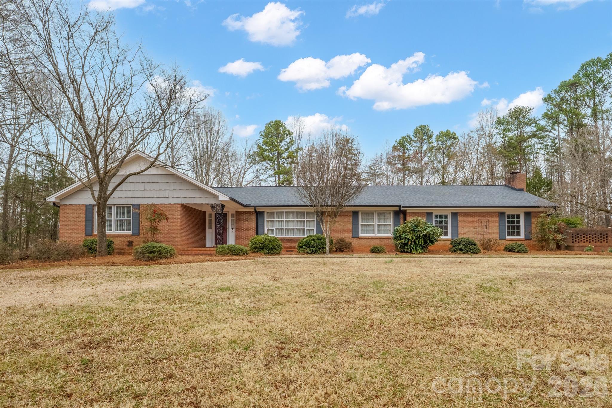 333 Sandy Ford Road Mount Holly, NC 28120 - Photo 2 of 42 a front view of a house with a yard