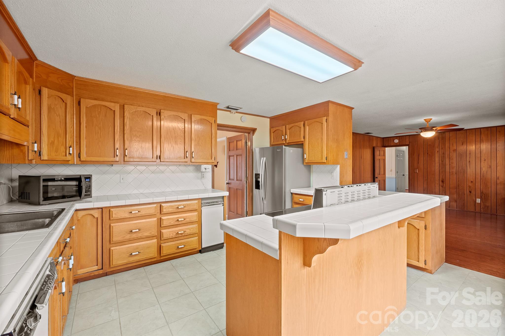 333 Sandy Ford Road Mount Holly, NC 28120 - Photo 21 of 42 a kitchen with stainless steel appliances granite countertop a sink stove and refrigerator