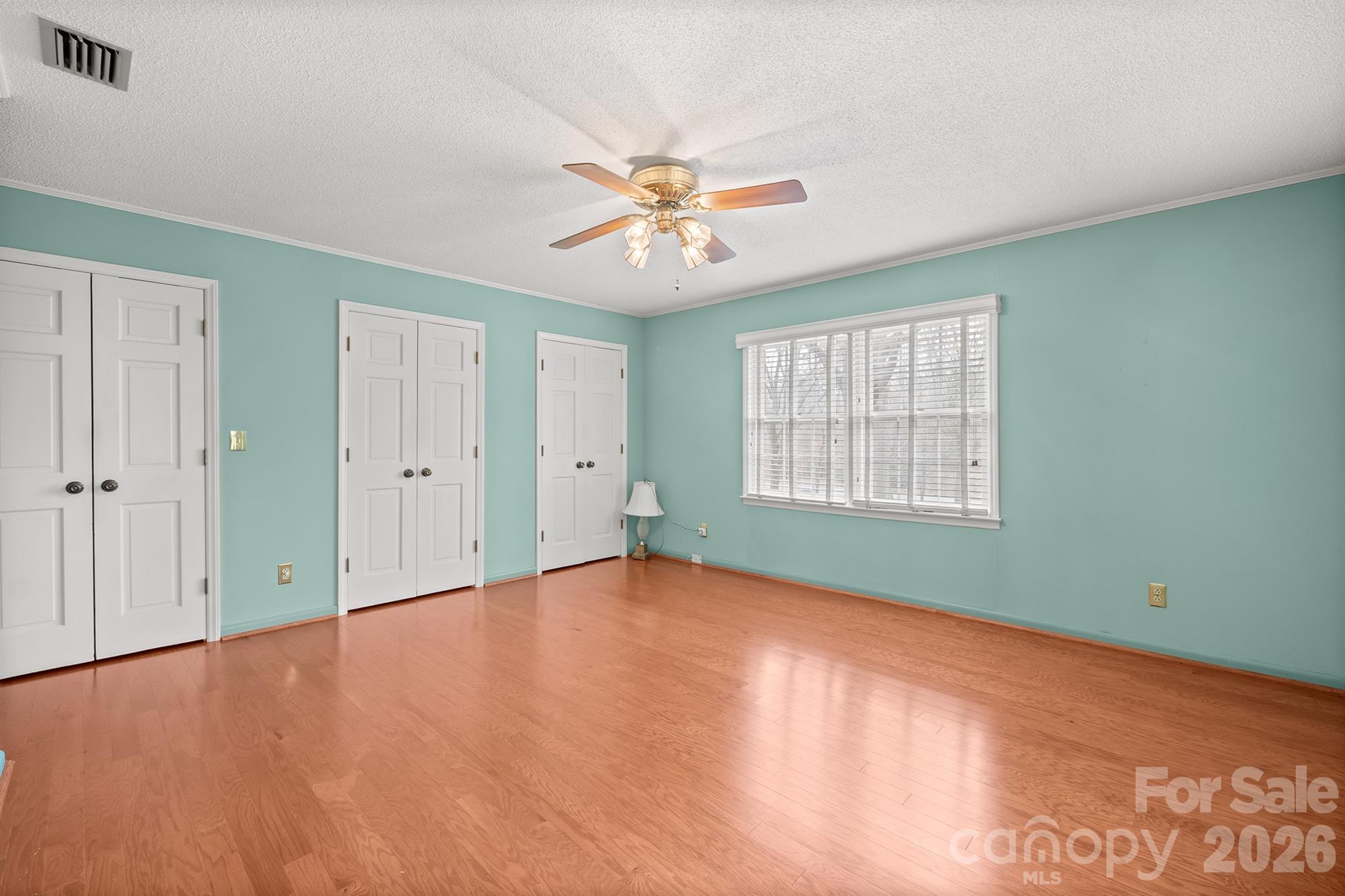 333 Sandy Ford Road Mount Holly, NC 28120 - Photo 29 of 42 a view of an empty room with window and chandelier fan
