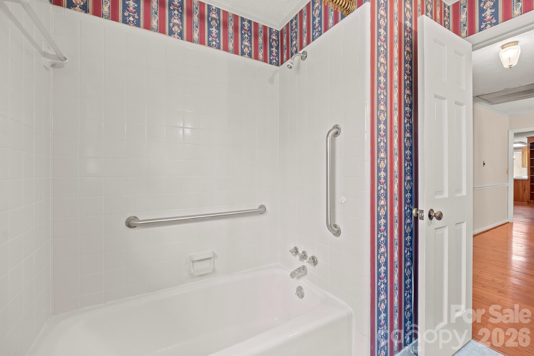 333 Sandy Ford Road Mount Holly, NC 28120 - Photo 33 of 42 a bathroom with a bathtub and a shower