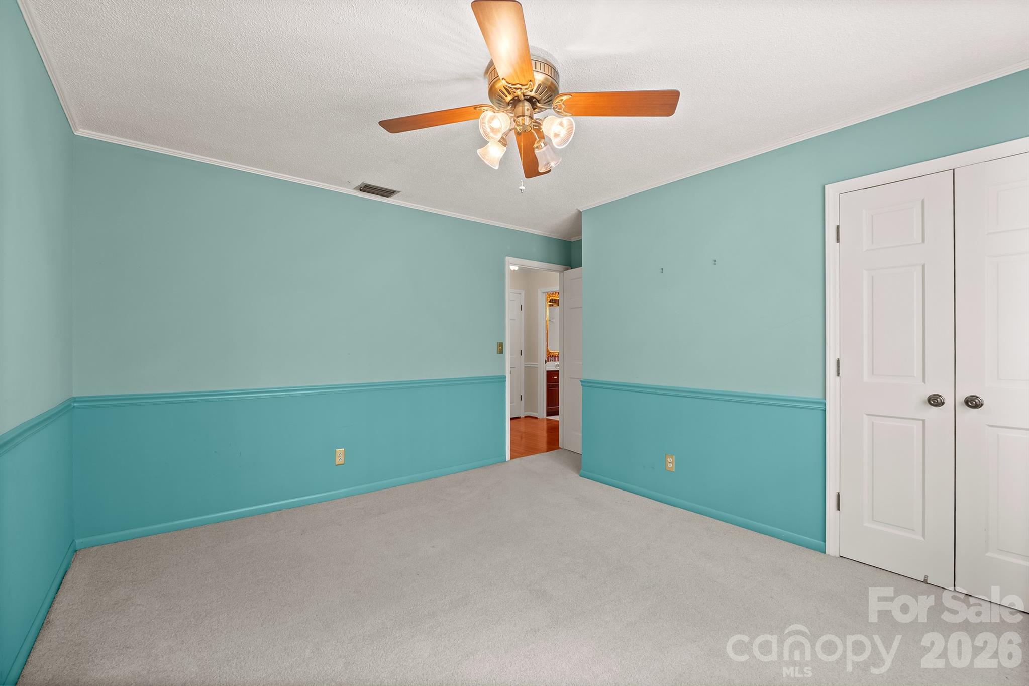 333 Sandy Ford Road Mount Holly, NC 28120 - Photo 34 of 42 a view of a room with a refrigerator and ceiling fan